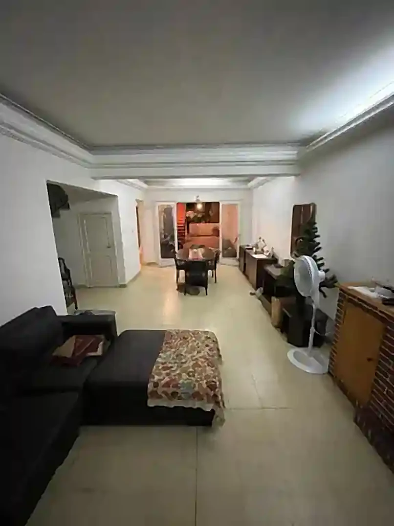 Living room at Ballario Guest House with sofa and table